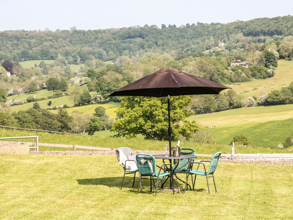 An outdoor area with a table and chairs at Farm View Annex in Painswick