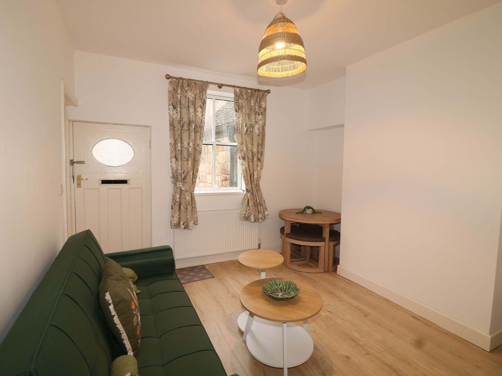 A living room with a sofa and tables at 14 Crown terrace in Belper