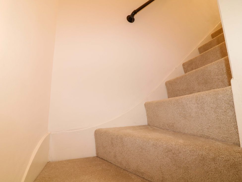 A staircase with carpet and a handrail at 14 Crown terrace Belper