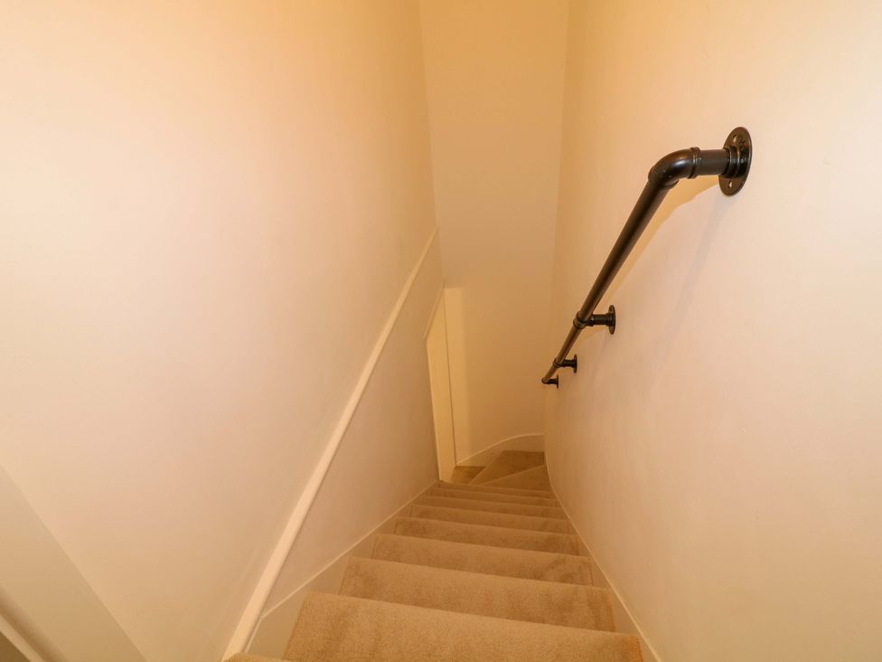 A staircase with a handrail at 14 Crown terrace in Belper