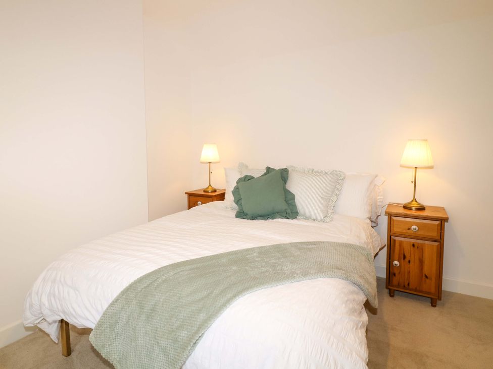 A bedroom with a bed and nightstand at 14 Crown terrace in Belper