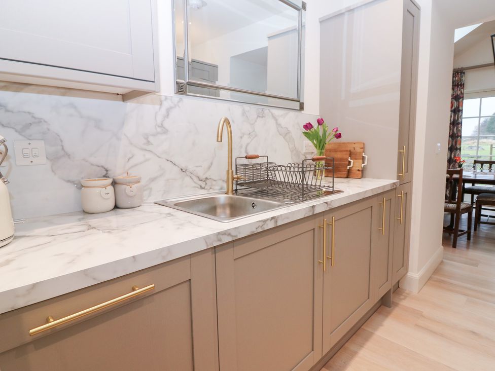A kitchen with sink and marble countertop at 4 East Camno Farm Cottages Near Meigle