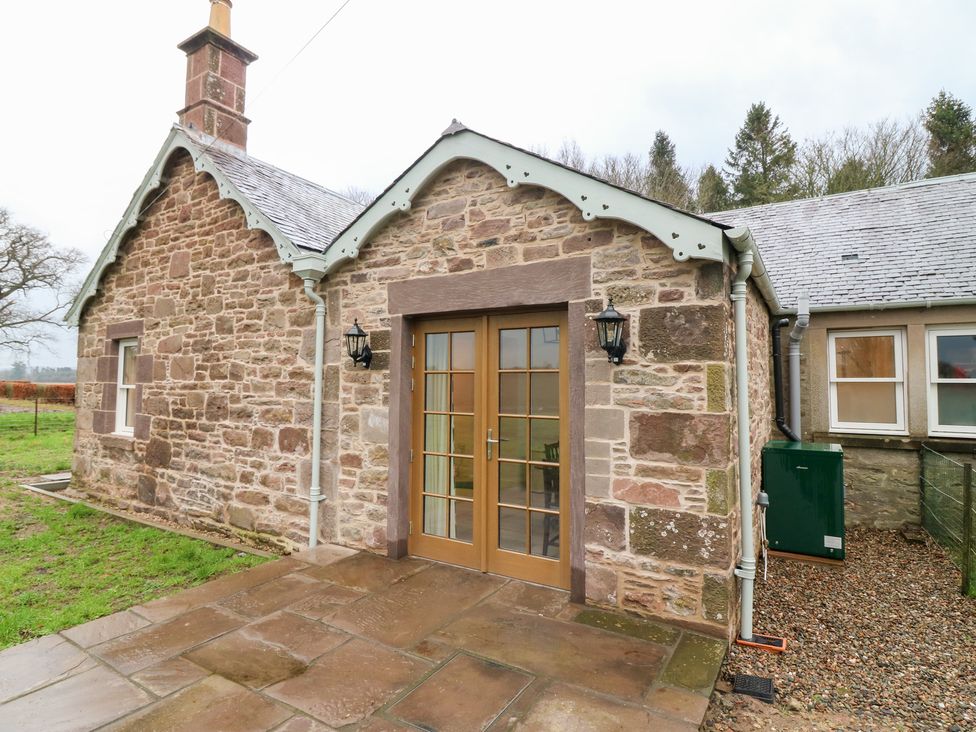 An exterior view of a stone building with double doors at 4 East Camno Farm Cottages near Meigle