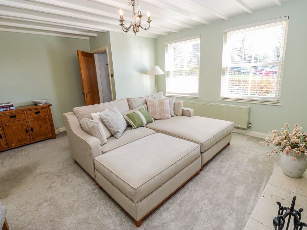 A living room with a sofa and a coffee table at 27 West Green