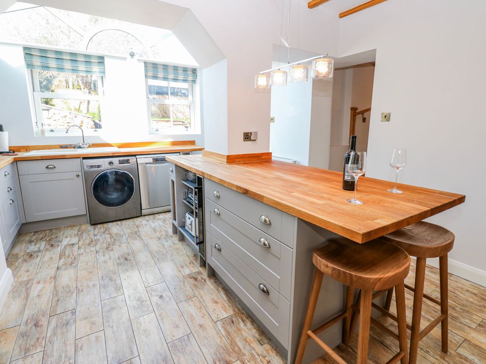 A kitchen with appliances and a kitchen island at 27 West Green in 
