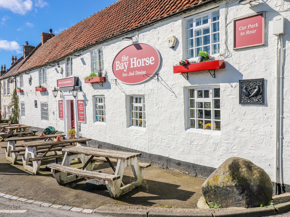 An exterior view of The Bay Horse with outdoor seating at 27 West Green