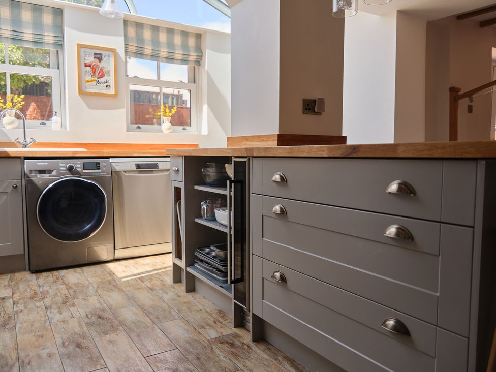 A kitchen with appliances and cabinets at 27 West Green Heighington