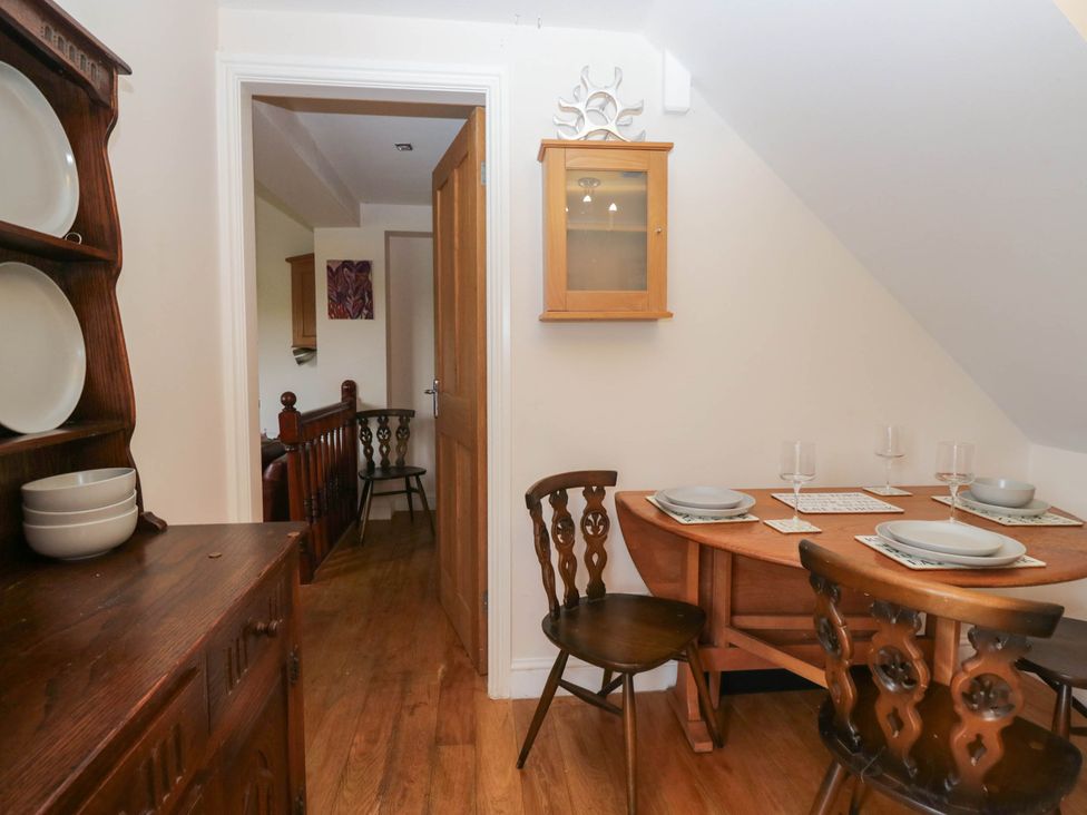 A dining room with a table and chairs at The Spinney near Milnthorpe