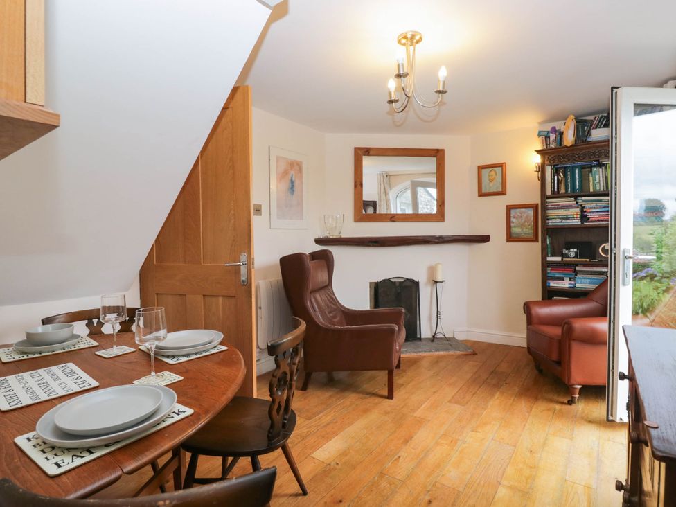 A dining room with a table and chairs at The Spinney near Milnthorpe