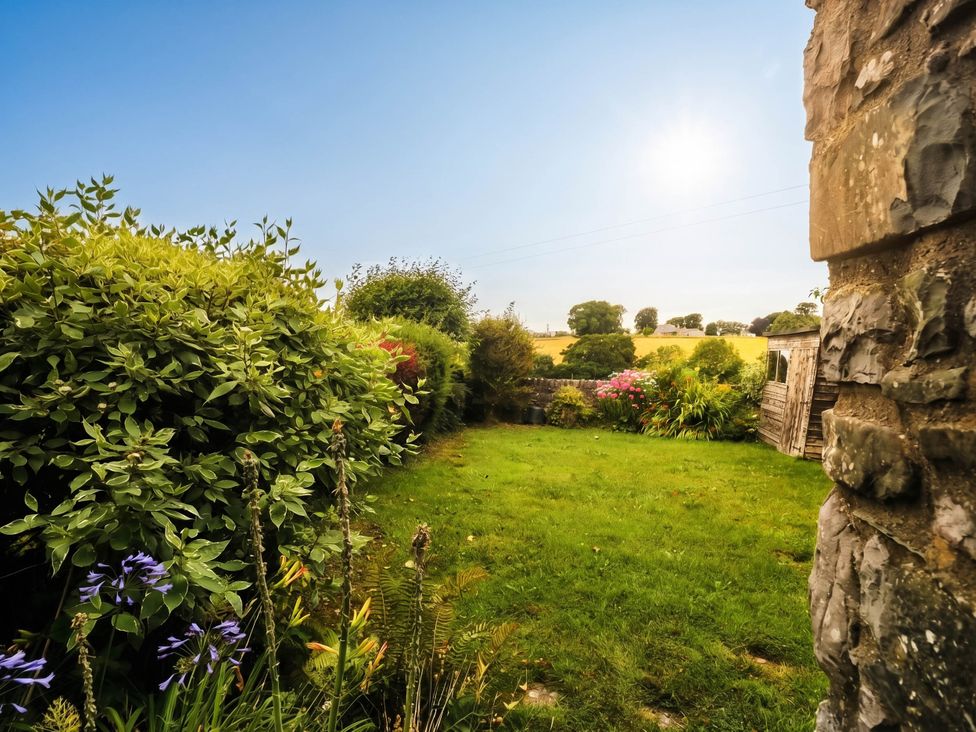 A garden with bushes and flowers at The Spinney near Milnthorpe