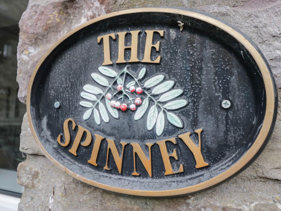 A sign with the name The Spinney on it near Milnthorpe