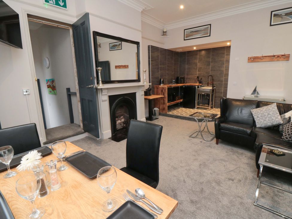 A dining area with a table and chairs at Ground Floor 1 bed Scarborough