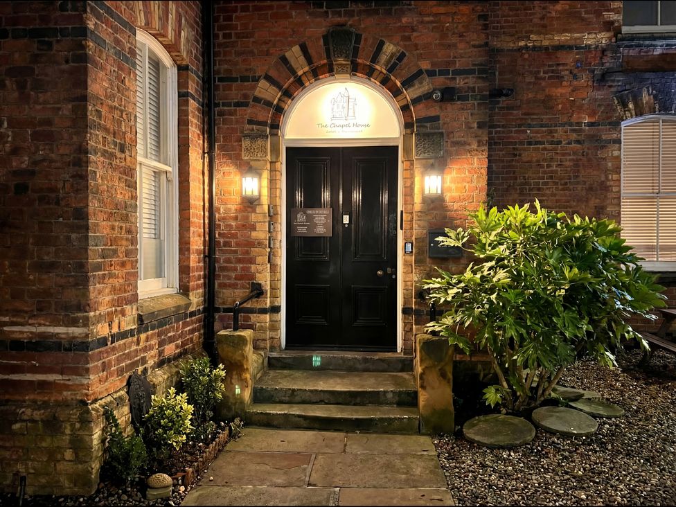 An entrance with a door and plants at The Chapel House in Scarborough