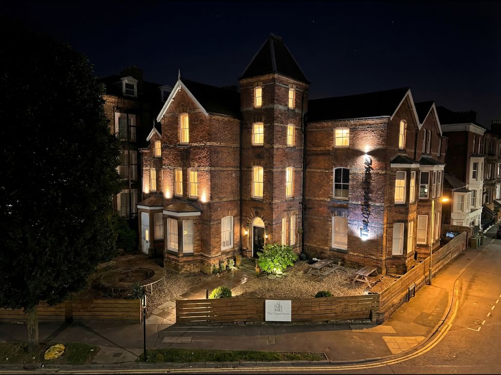 An exterior view of a brick building at night at The Chapel House in Scarborough