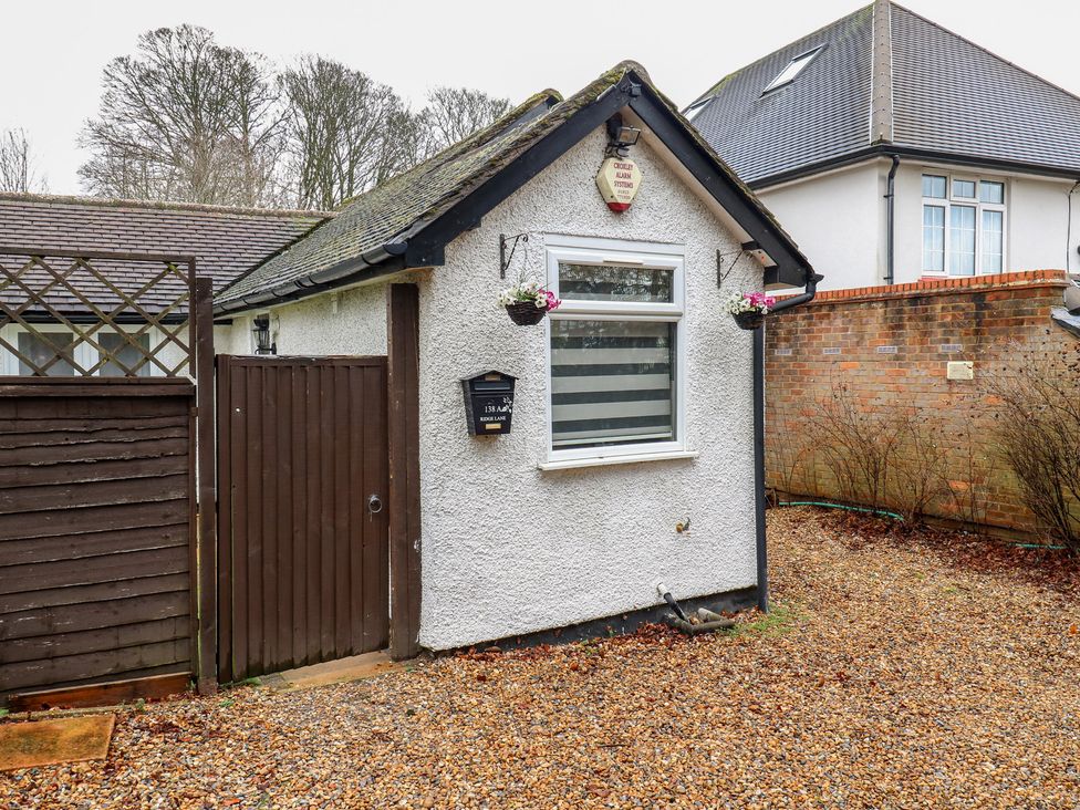 A property entrance with a gate and window at The Enchanted House in Watford