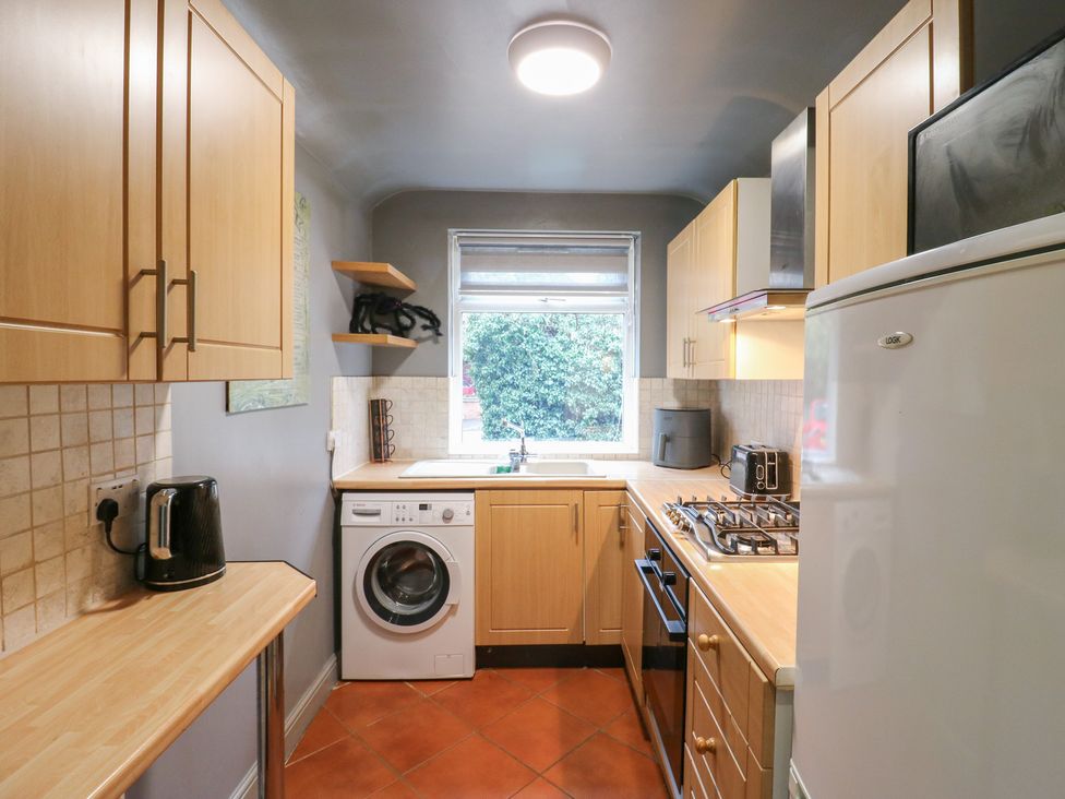 A kitchen with a sink and appliances at The Enchanted House in Watford