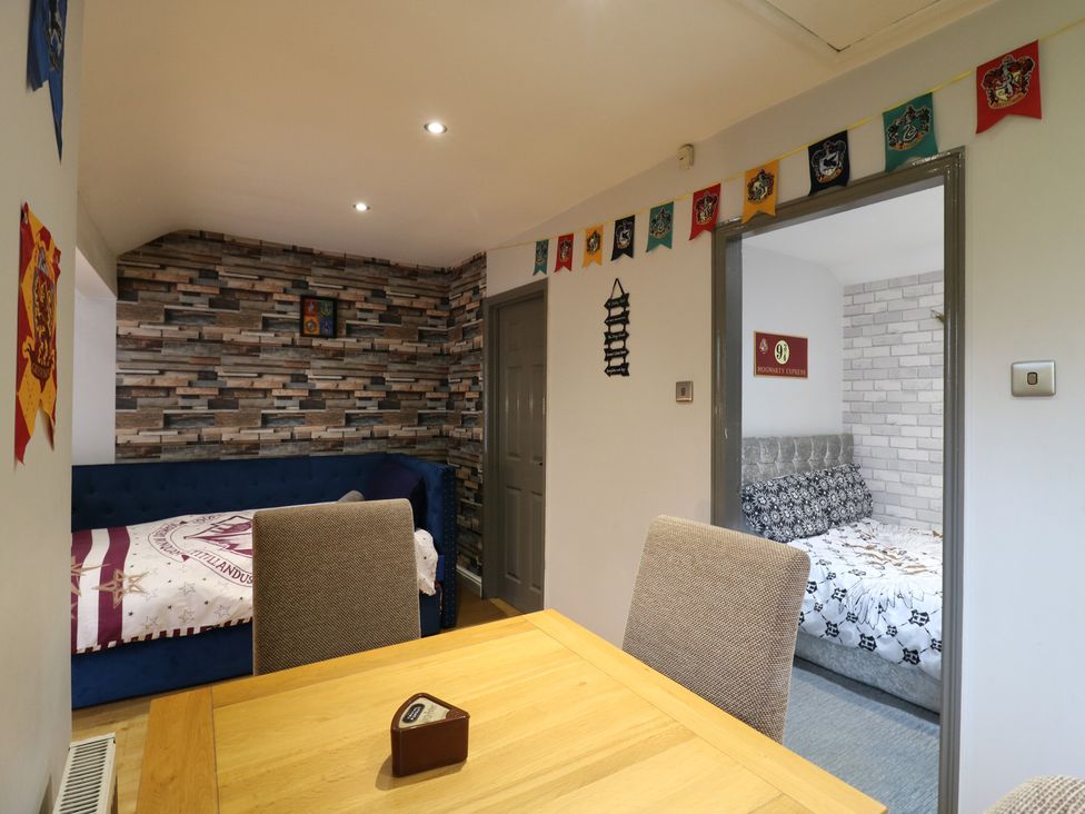 A bedroom with a couch and a bed at The Enchanted House in Watford