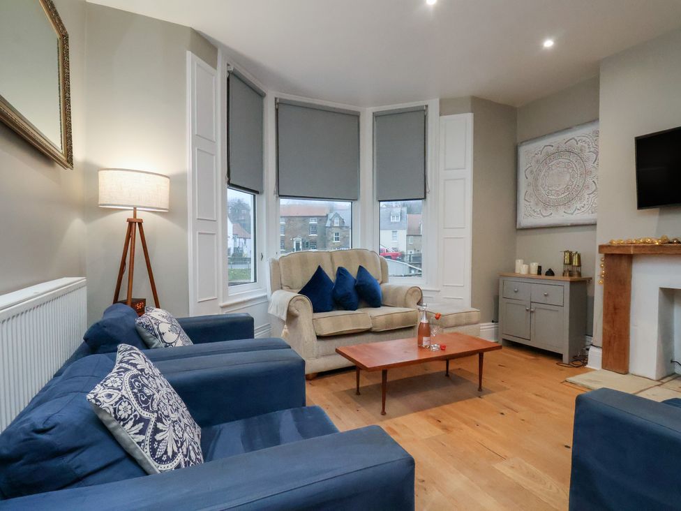 A living room with a sofa and armchairs at South Villa Sandsend near Whitby