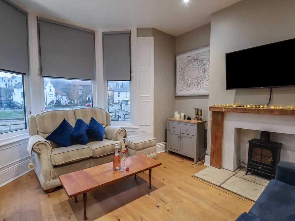 A living room with a sofa and coffee table at South Villa Sandsend near Whitby