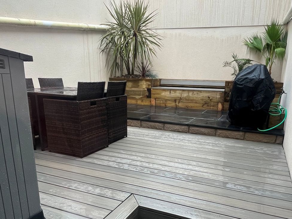 An outdoor area with a table and chairs at South Villa Sandsend near Whitby