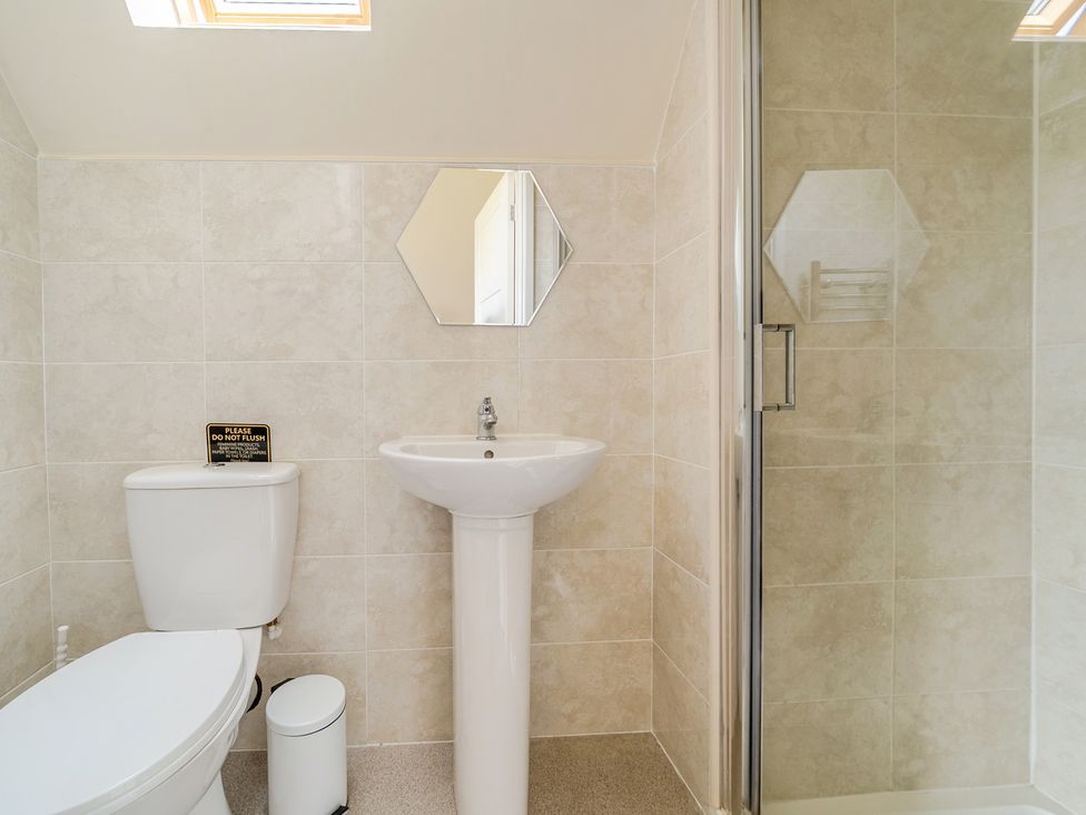 A bathroom with a toilet and sink at James Ville Marina Lodge 13 in Brigg