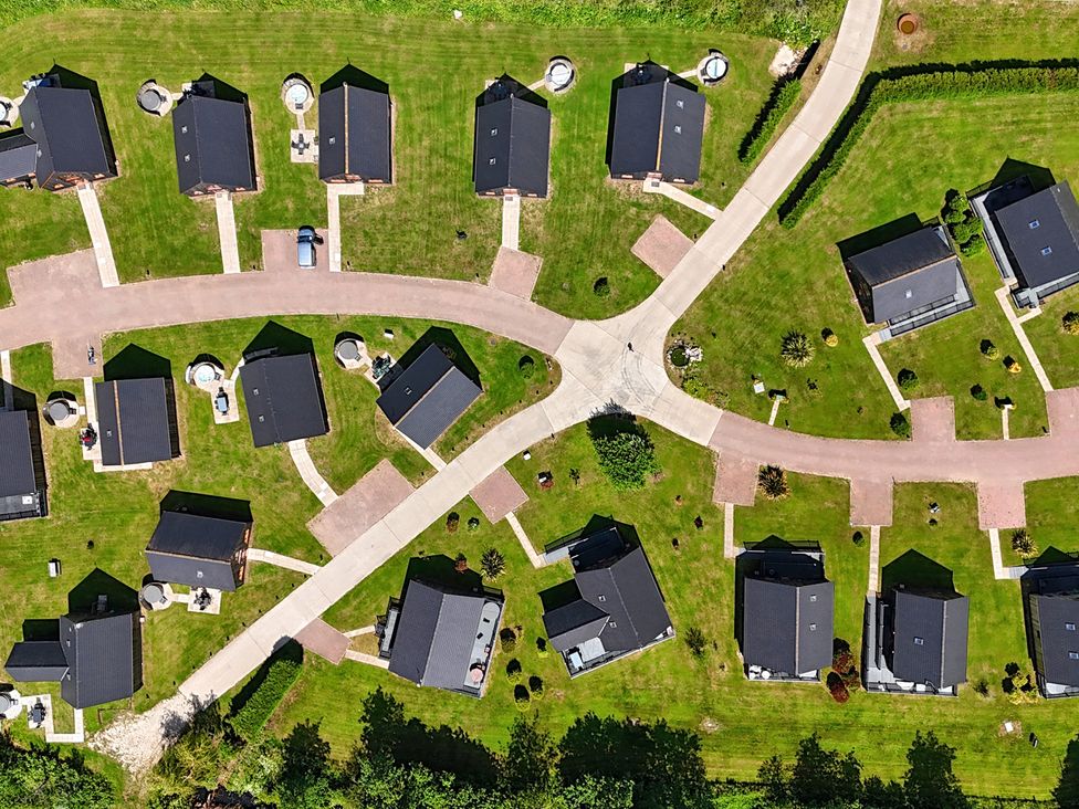 An aerial view of a residential area with houses and pathways at James Ville Marina Lodge 14 in Brigg