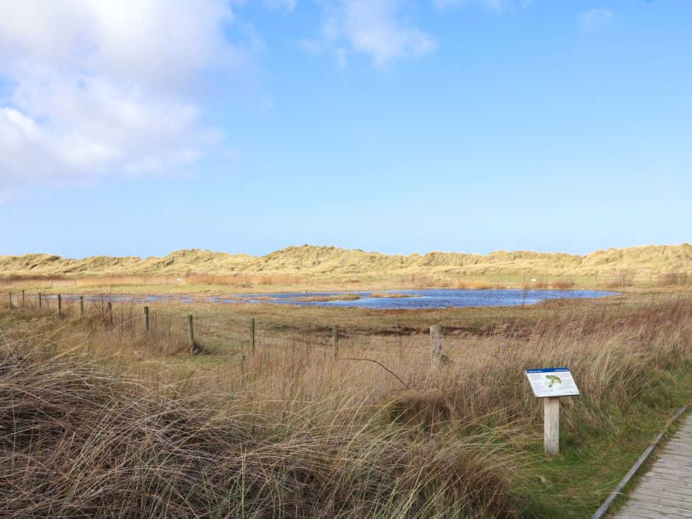 A landscape with dunes and water at Dunes View in Prestatyn