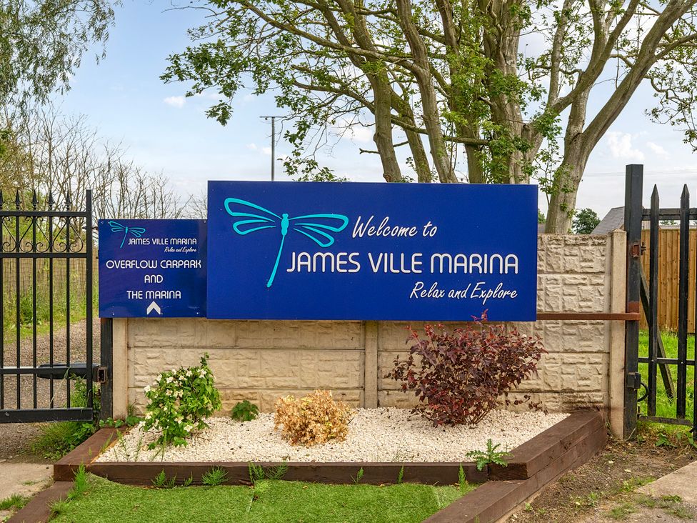 A welcoming sign of James Ville Marina at Brigg