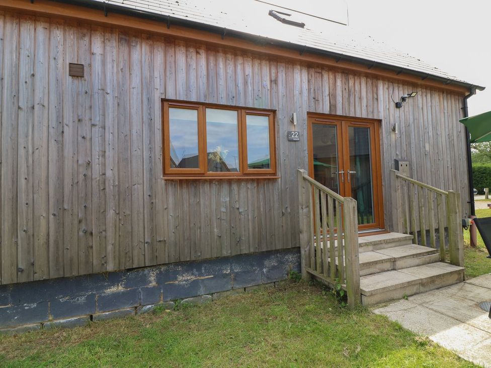 A wooden exterior of a building with steps at James Ville Marina Lodge 22 in Brigg