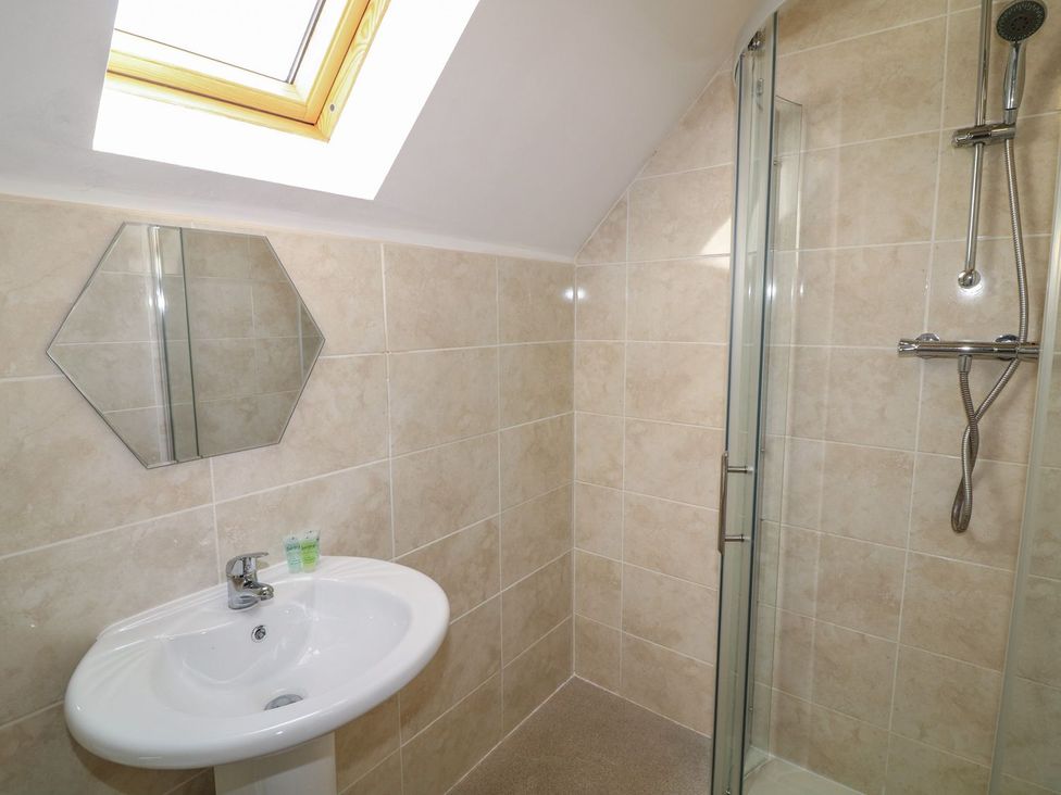 A bathroom with shower and sink at James Ville Marina Lodge 10 in Brigg