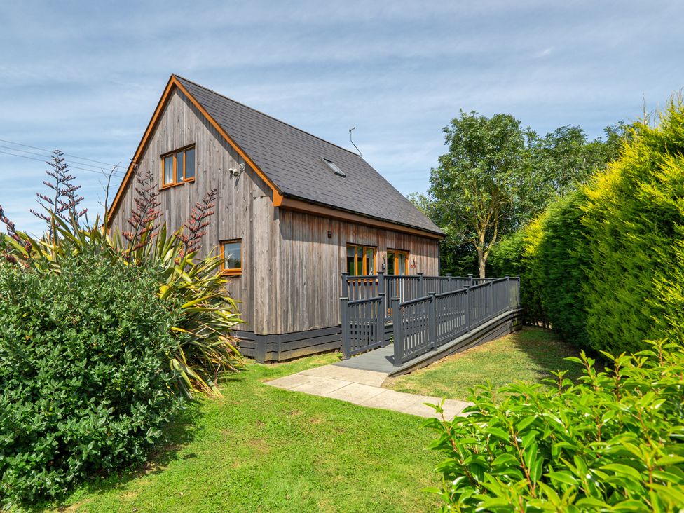 A house with a deck and garden at James Ville Marina Lodge 10 in Brigg