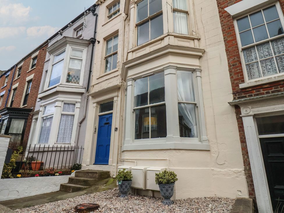 A building with a blue door and windows at Apartment 2 in Scarborough