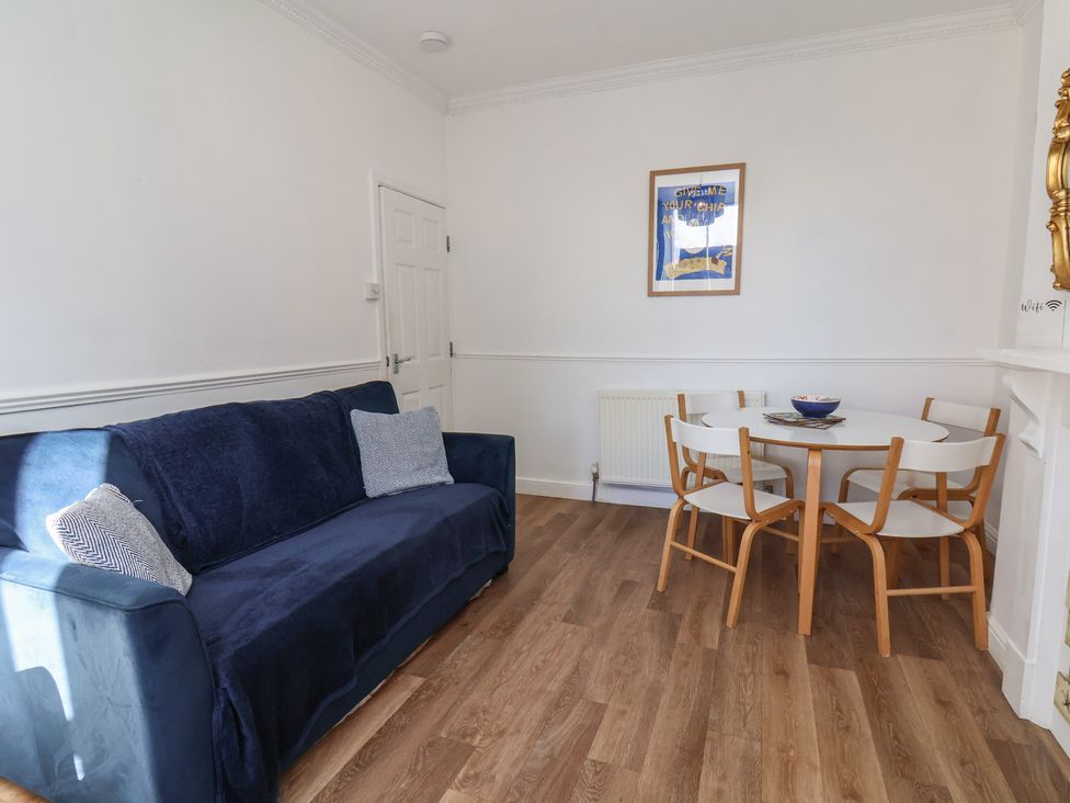 A dining room with a table and chairs at Apartment 2 in Scarborough