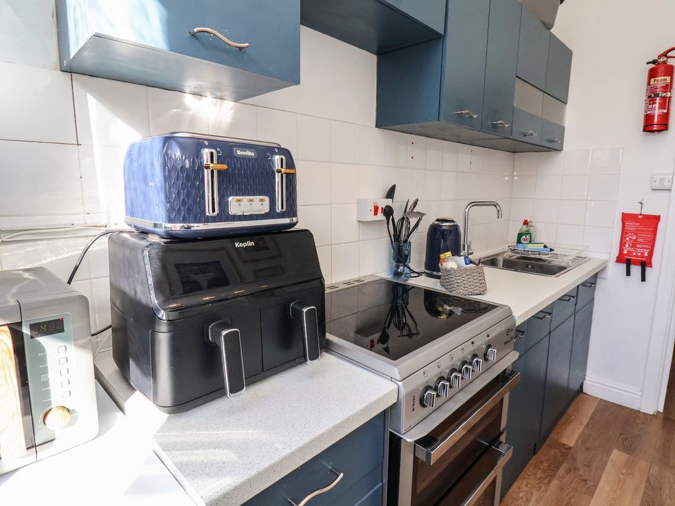 A kitchen with appliances including a toaster and air fryer at Apartment 2 in Scarborough