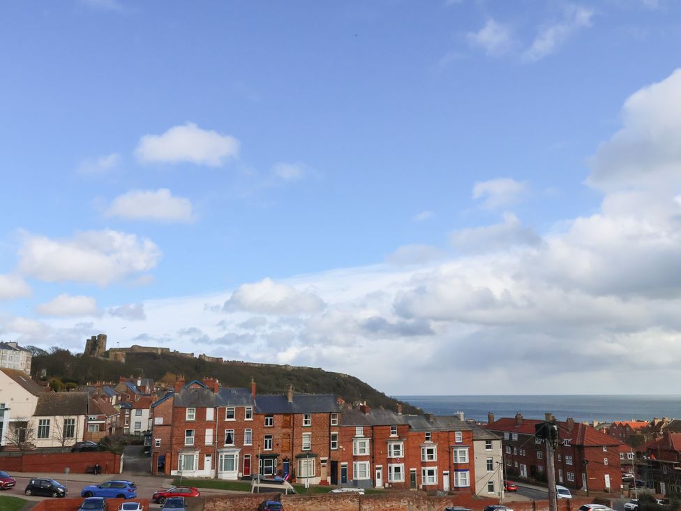 A view of houses and the sea at Apartment 3 in Scarborough