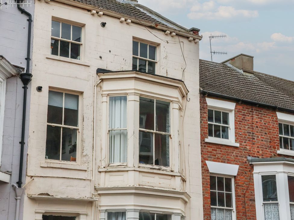 A building with windows and brick walls at Apartment 3 Scarborough
