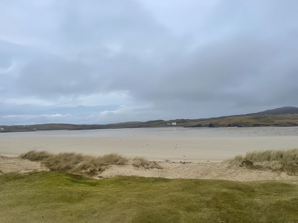 A beach with sand and water at 15 New Shawbost in Shawbost