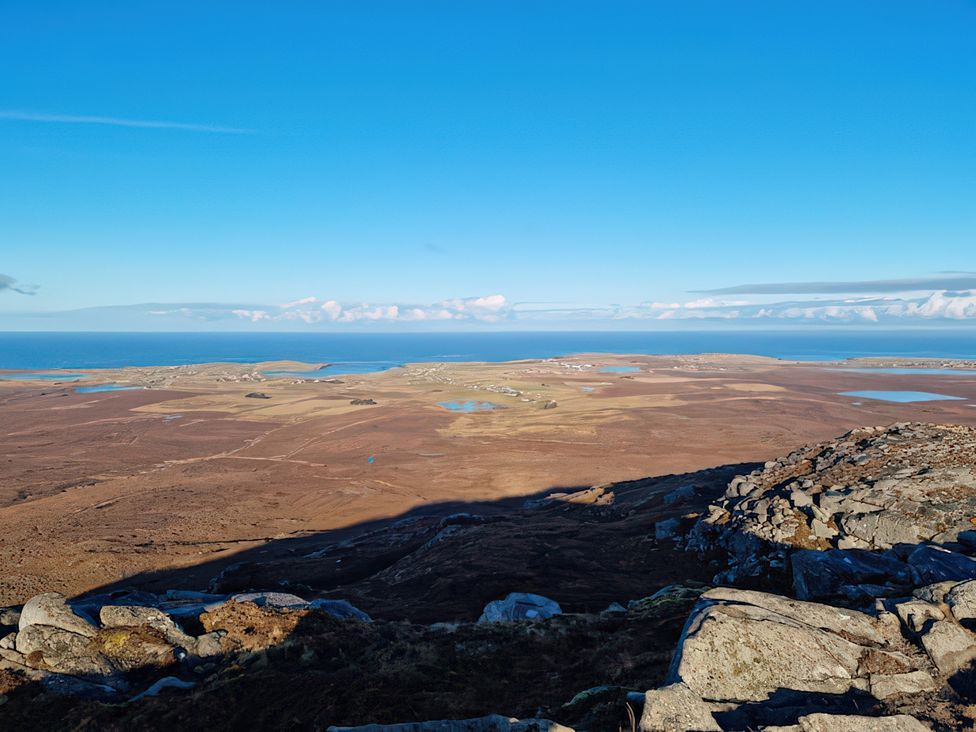 A panoramic view of a coastal landscape at 15 New Shawbost in Shawbost