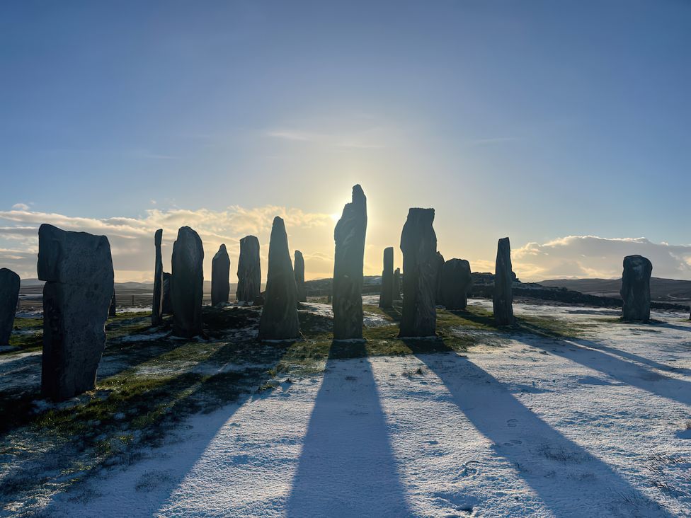Standing stones with snow and shadows at 15 New Shawbost in Shawbost