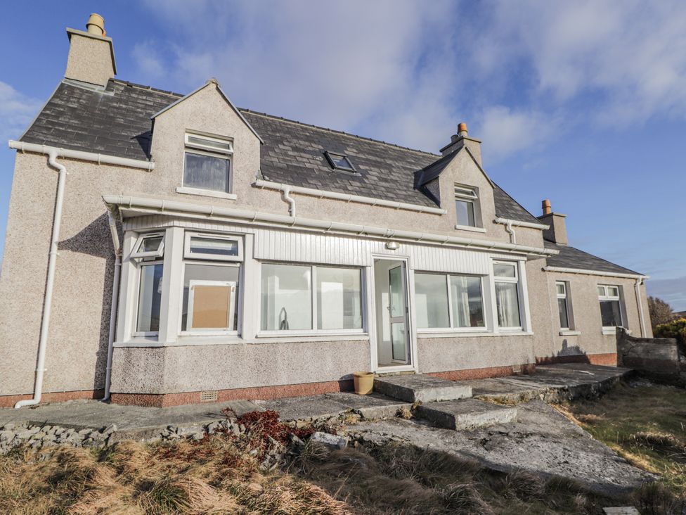 A house with windows and a path at 15 New Shawbost in Shawbost