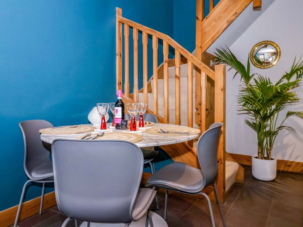 A dining area with a table and chairs at The Green in Sawley near Ripon