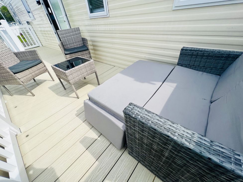 An outdoor patio with seating arrangement at The Wild’s Waterside Haven in Cleethorpes