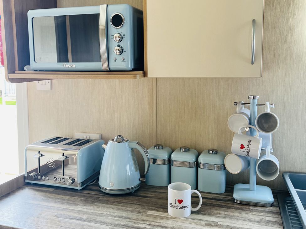 A kitchen with appliances and storage jars at The Wild’s Waterside Haven, Cleethorpes