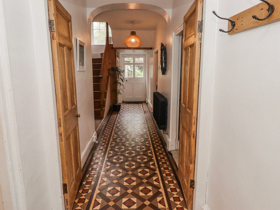 A hallway with a staircase at The Secret Garden in Narberth