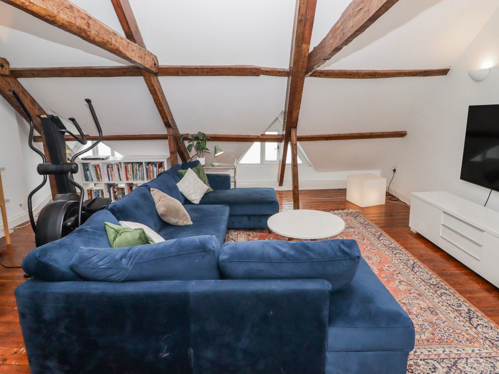 A living room with a sofa and coffee table at The Secret Garden in Narberth