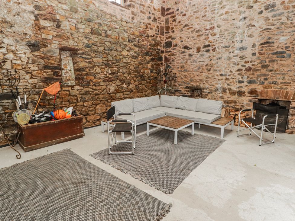 A seating area with a sofa and coffee table at The Secret Garden in Narberth