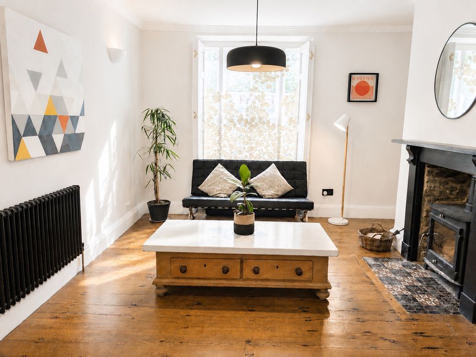 A living room with a coffee table and sofa at The Secret Garden in Narberth
