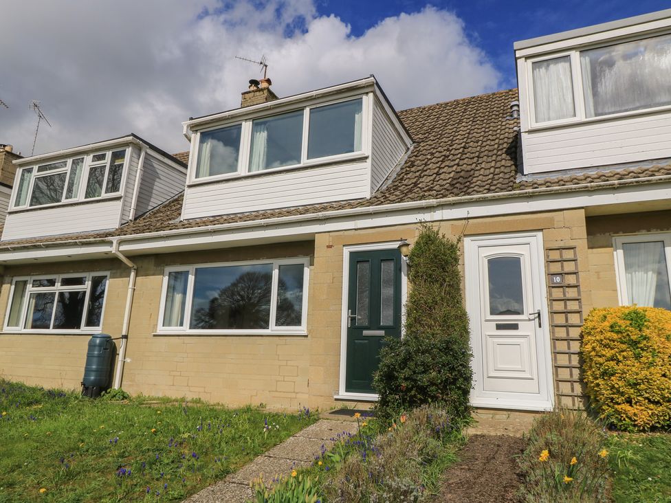 A house with garden and pathway at 11 Berry Close in Painswick