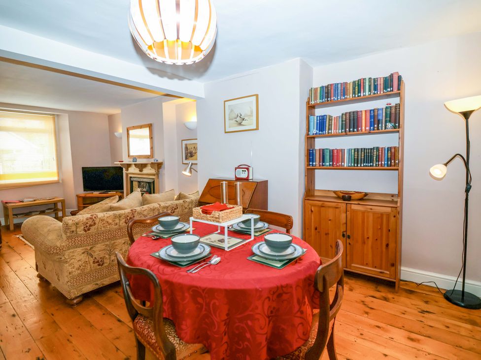 A dining area with a table set for a meal at 12 Heathfield Terrace