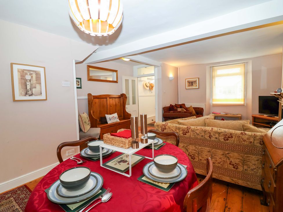 A dining room with a table set for four at 12 Heathfield Terrace 